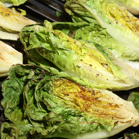 Grilled Romaine Lettuce Hearts with Warm Dressing and Roasted Tomatoes