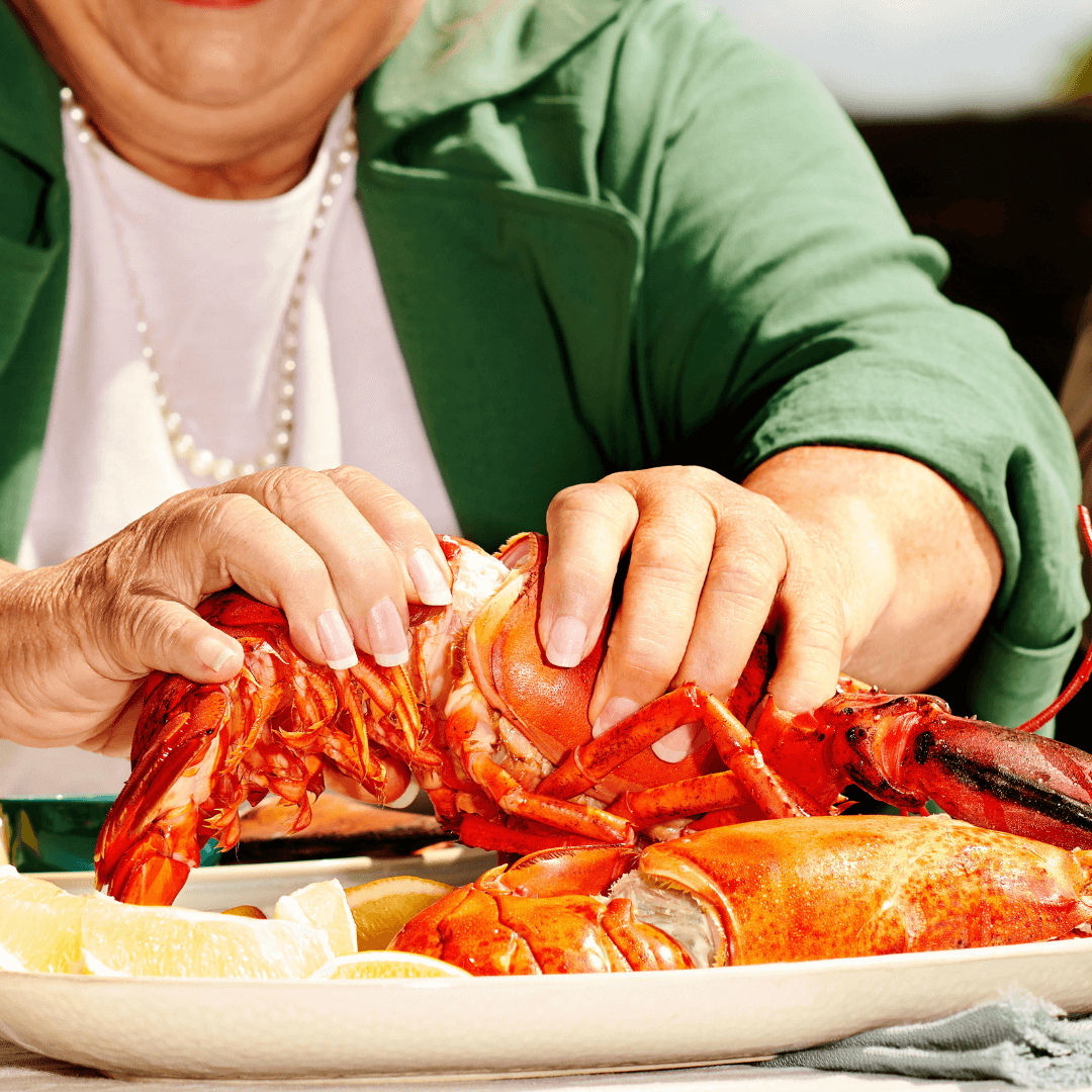 Person handling a lobster Person handling a lobster