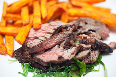 Jerk Style Flat Iron Steak with Sweet Potato Strings