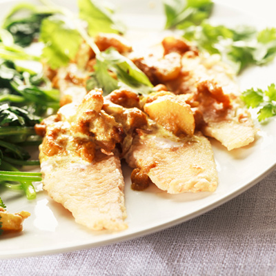 Greenland halibut on spinach leaves with pear