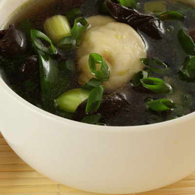 Mushroom Soup with Won Tons Filled with Frog Legs, Spinach and Salted Herring