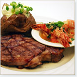 Boneless strip loin steak and garlic scampi in Provençale style tomato coulis