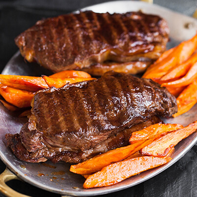 Herb-Marinated Striploin Steaks with Sweet Potato