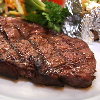 Striploin Steaks and Foil-Wrapped Vegetables
