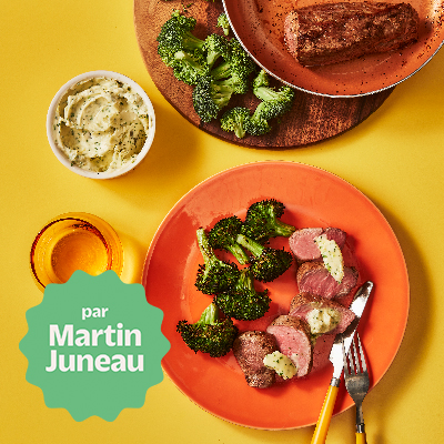 Pork tenderloin topped with lemon zest and chive flavoured butter, roasted broccoli