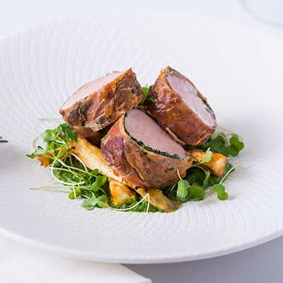 Prosciutto Wrapped Loin, Spicy Roasted Roots & Creamed Greens