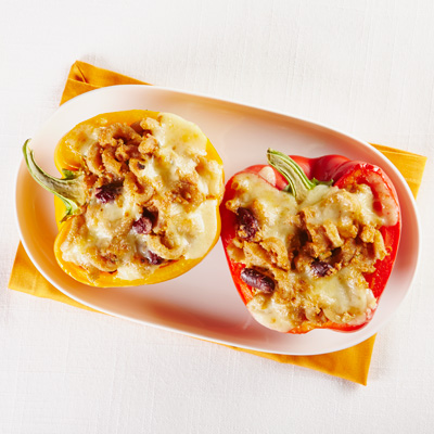 Bell Peppers Stuffed with Rice, Raclette Cheese and Pine Nuts