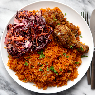 Ghanaian Jollof rice and chicken with coleslaw