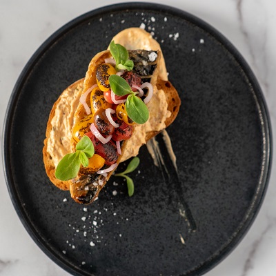 Mackerel Toast with Canned Tuna, Charred Cherry Tomatoes, and Pickled Shallots